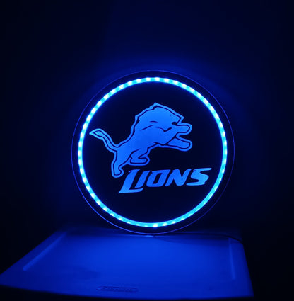 Blue neon sign with a logo on a dark background